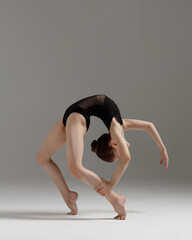 Young gymnast girl stretching and training