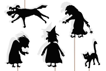Black shadow puppets of witches, isolated 