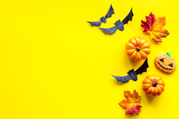 Halloween holiday banner design - pumpkins, cookies and autumn leaves, top view