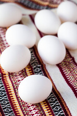 Fresh farm eggs with textile background