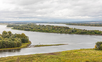 View  in early autumn from the high Bank at the confluence of the Toima river and Kama river . Russia, Tatarstan, Yelabuga.