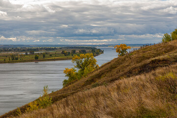 View  in early autumn from the high Bank at the confluence of the Toima river and Kama river ....
