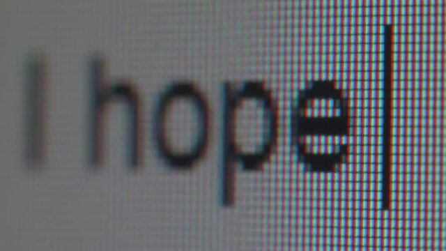 Typing a phrase full of expectations. Macro view.