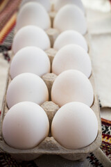 Fresh farm eggs with textile background