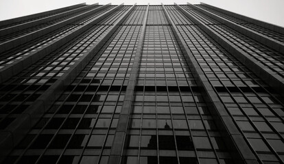 Fototapeta premium Street Level View Looking Up at a Minimalist, Clean Lined Skyscraper in Manhattan, New York