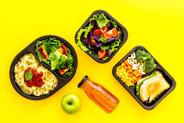 Delivery containers with takeout food on table. View from above