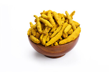 Turmeric sticks in wooden bowl in white background.