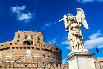 Castel Sant'Angelo and angel statue during sunny day in Rome, Italy