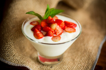 sweet homemade yogurt with red ripe fresh strawberries
