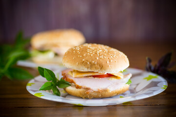 morning sandwich with bacon, cheese and herbs