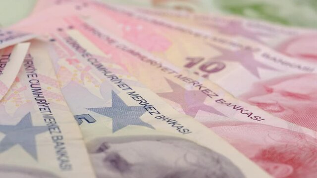 Lira banknotes macro detail. Various Turkish lira banknotes closeup turning background.