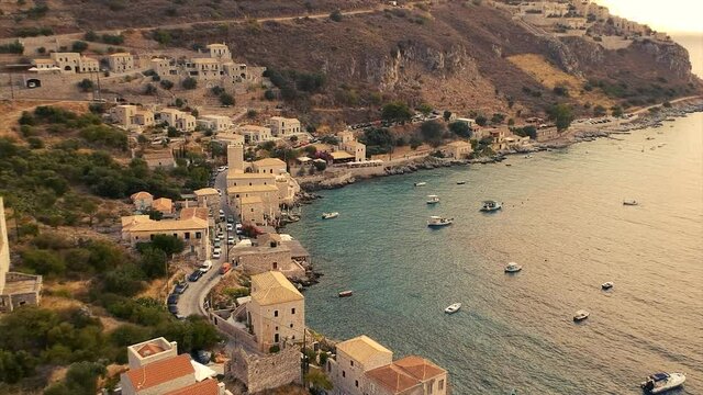 Scenic aerial view from the picturesque seaside village Limeni at sunset. Traditional houses and colorful stoned buildings and luxurious hotels in Limeni, Mani area, Laconia, Greece, Europe