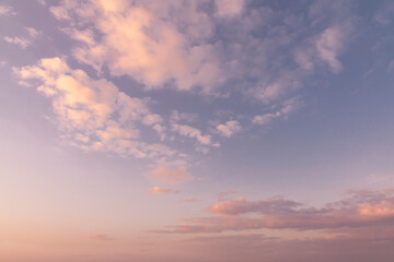 Pink clouds in the post-sunset sky at the blue hour.