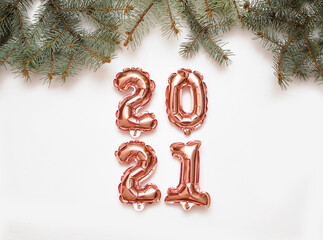 Shiny symbols of new year , balloons 2021 on festive background.