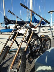 Two old bicycles sitting on the boat dock in Sausalito California