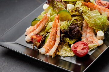 Fresh seafood salad served with prawns (shrimps )