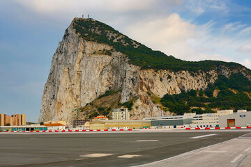 Gibraltar airport runway is in the middle of the city the roar of the Monarch Air fltake offs and landings are deafening.