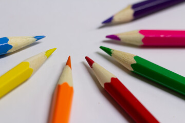 colored pencils on a white background