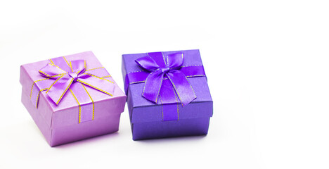 Purple, pink gift box with white background. Holiday greeting card. Christmas, new year, birthday. Space for text