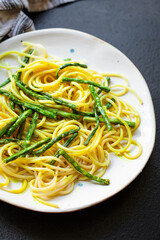 spaghetti pasta green bean asparagus sauce second course vegetarian serving size top view copy space for text food background rustic