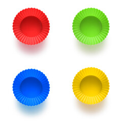 Four colorful cupcake or muffin mold isolated on white background.