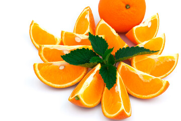 Orange with slices and green leaves of mint on white background - 378601914