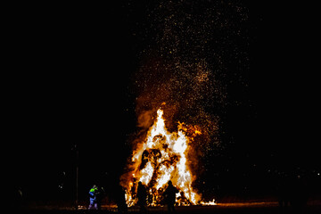 Ancient tradition of Epiphany fires in Friuli, Italy. Burning of a straw effigy. Farewell to winter, arrival of spring