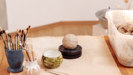 DIY create a Cup of clay by hand modeling. Step 3. Form a smooth circle of clay High quality photo