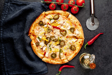 Mexican pizza with ingredients on stone background