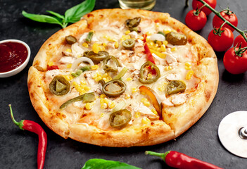 Mexican pizza with ingredients on stone background