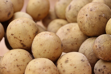 Closeup Longkong on wooden table, tropical fruit in thailand