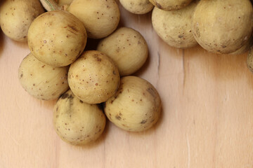 Closeup Longkong on wooden table, tropical fruit in thailand