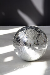 Silver disco ball in the morning sun
