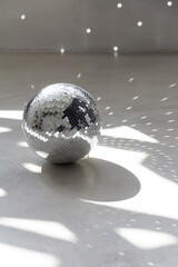 Silver disco ball in the morning sun