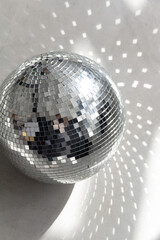 Silver disco ball in the morning sun
