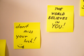 Screws and washers decorated as Christmas tree on a yellow background. Christmas greeting card and Happy new year greeting card concept. Top view with copy space for your text 