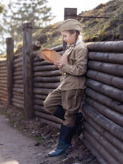 Fototapeta premium Girl Soviet soldier during the Second World War. Stylized shooting. Victory Day.