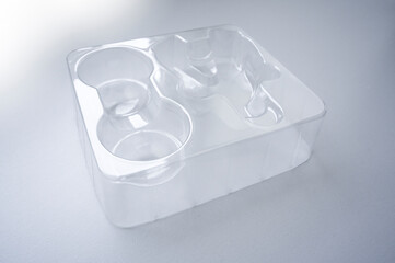 An transparent plastic packaging for goods to transport