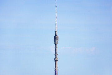 Obraz premium top of Ostankinskaya TV tower and blue sky on sunny day in Moscow city