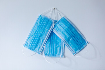 Surgical masks on a neutral wooden or white background to prevent the new covid-19 disease