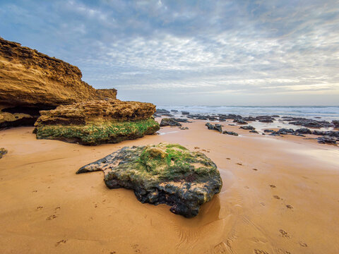 carcavelos beach with rock formations