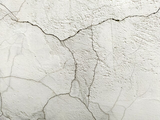 Background with a cracked white stone wall