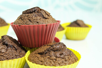 Baked muffins on a white table.Close -up