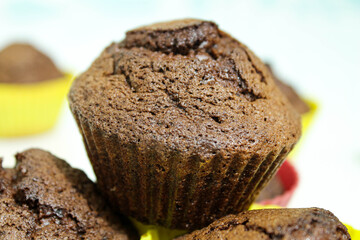 Baked muffins on a white table.Close -up