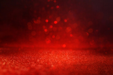 background of abstract red, gold and black glitter lights. defocused