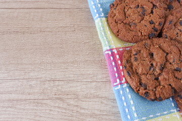 Homemade cookies close-up, place for text. Chocolate chip cookies.  Chocolate chip cookies on wooden table with space for text