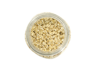 Glass jar full of natural oats, isolated on white background.
