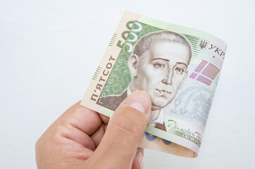 banknote of 500 hryvnia in a woman's hand. Close-up.