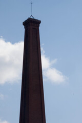 Brick smoke stack against the sky