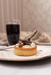 Caramel tart with cup of coffee